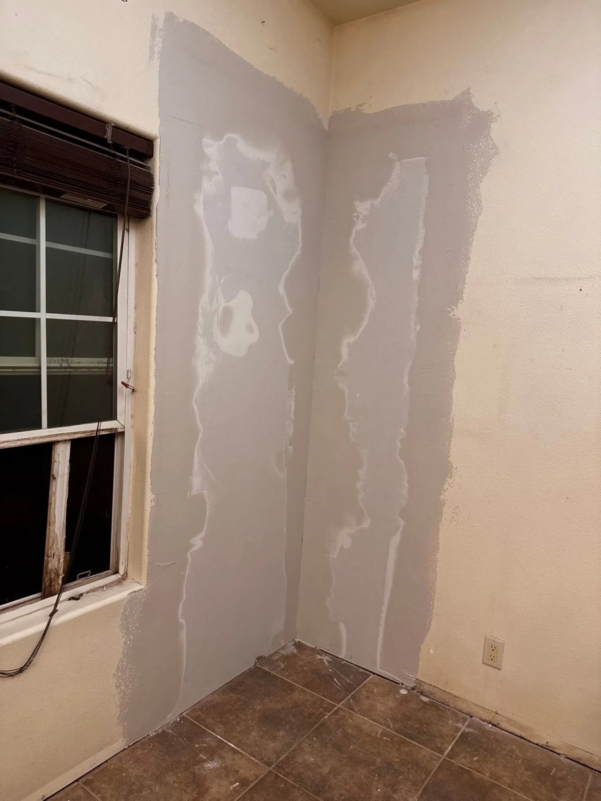 Interior drywall patch taped and floated ready for texture
