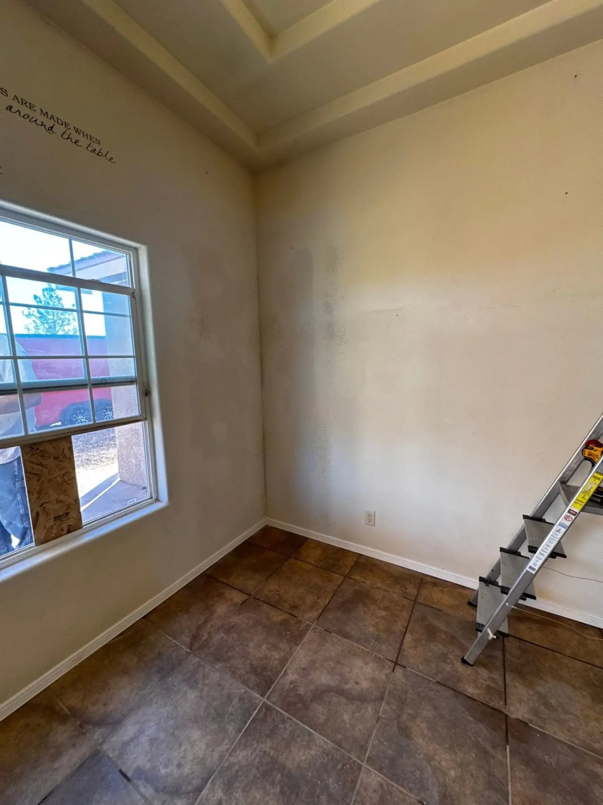 Interior room prepped for repainting after drywall repairs
